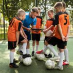 football trainer teaching his pupils 23 2149707981