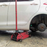 White cars change wheels using