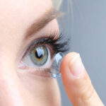 woman putting in a contact lens 1536x1008 1